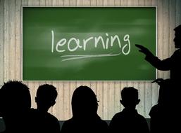 classroom people and board learning
