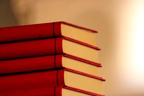 Stack of red books at blurred background