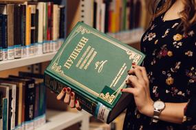 Pushkin's book in the hands of a girl