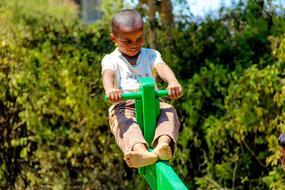 a child on a swing in Madagascar
