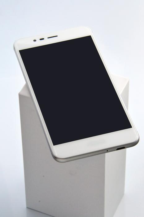 white smartphones on white square