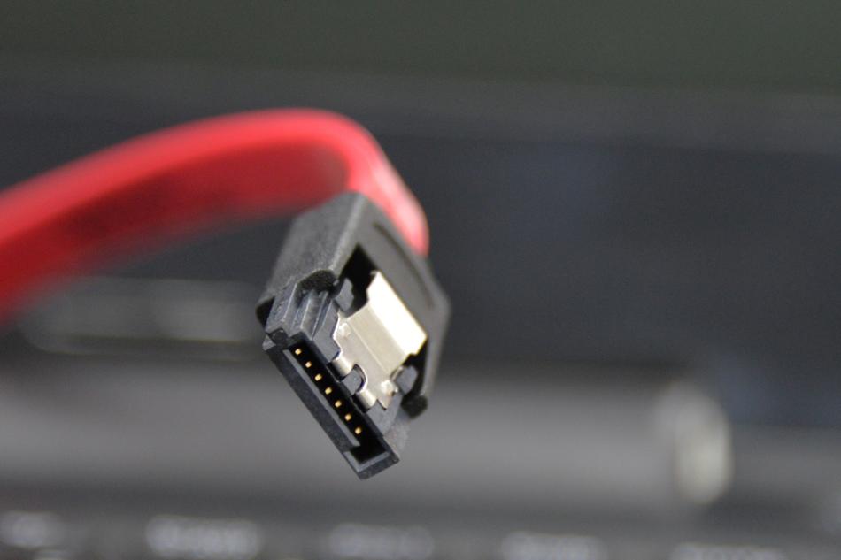 Close-up of the black, red and white cable, at blurred background