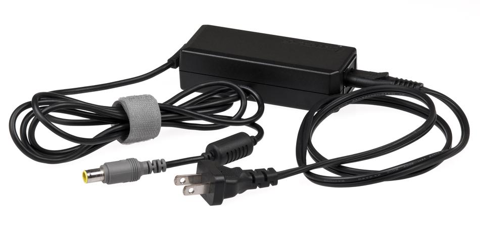 Black and grey power brick with cables, at white background, clipart