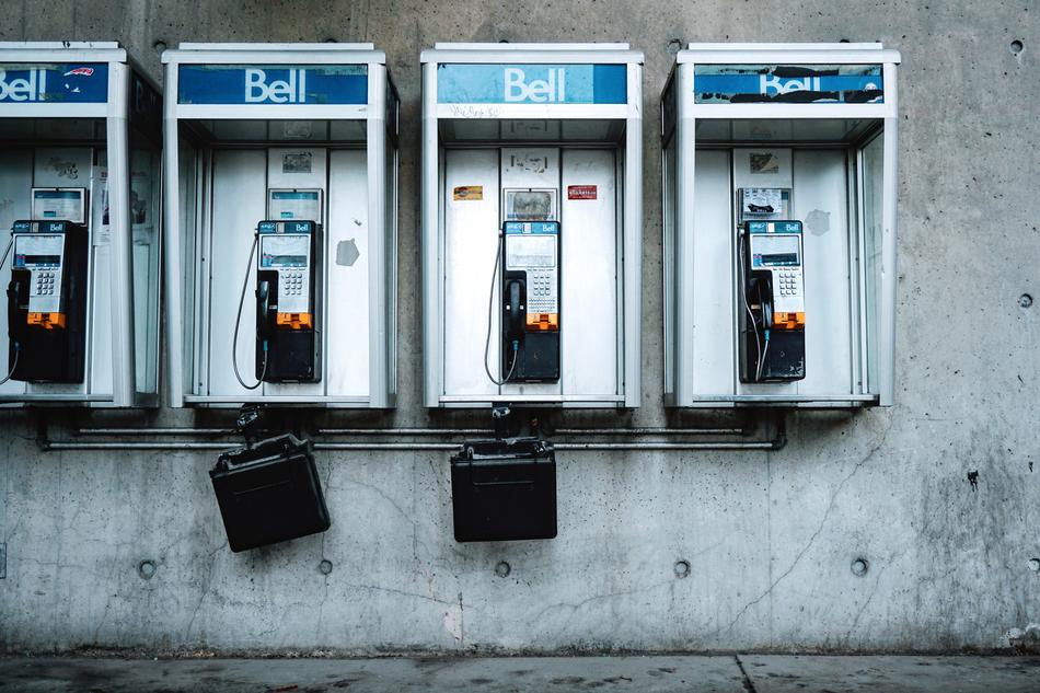 payphones on the wall of the building