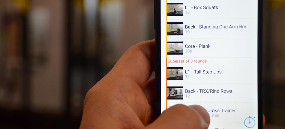 fitness app on smartphone screen on blurred background