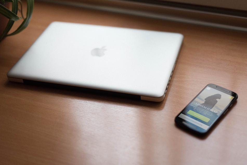 apple Notebook and Phone on desk