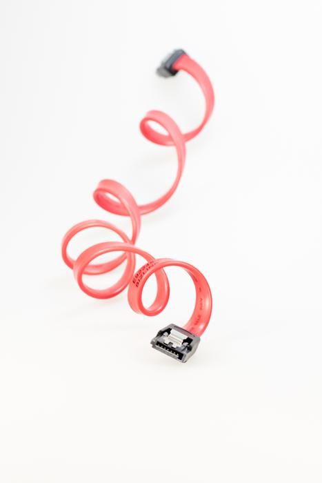 Pink and black SATA cable, at white background