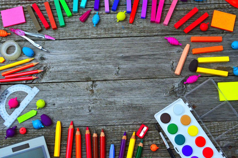 School Times, bright supplies on grey wooden desk