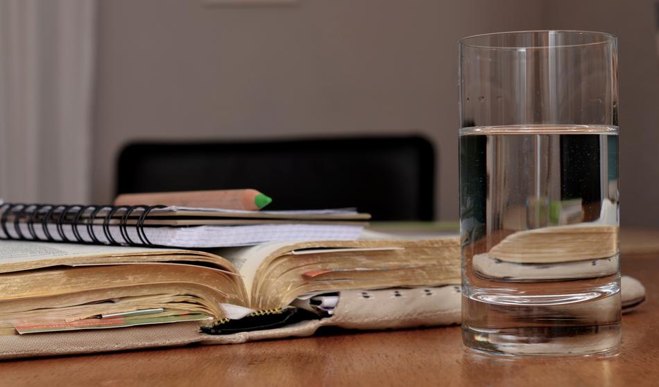 notebook and glass of water