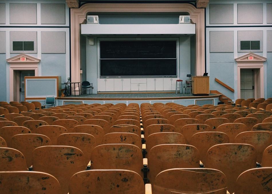 photo of wooden chairs in the classroom at the institute