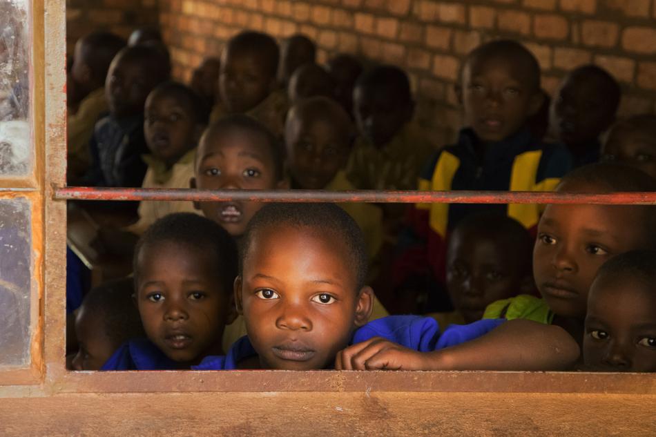 portrait of african schoolchildren look out the window