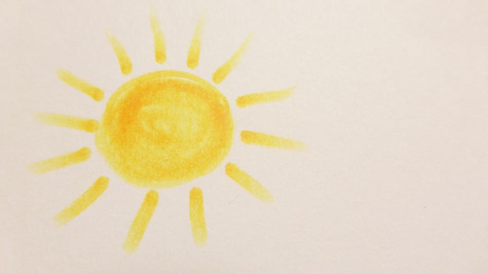 Drawing of the beautiful Sun on the paper