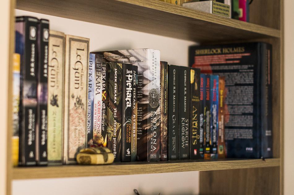 photo of books on the rack in the room