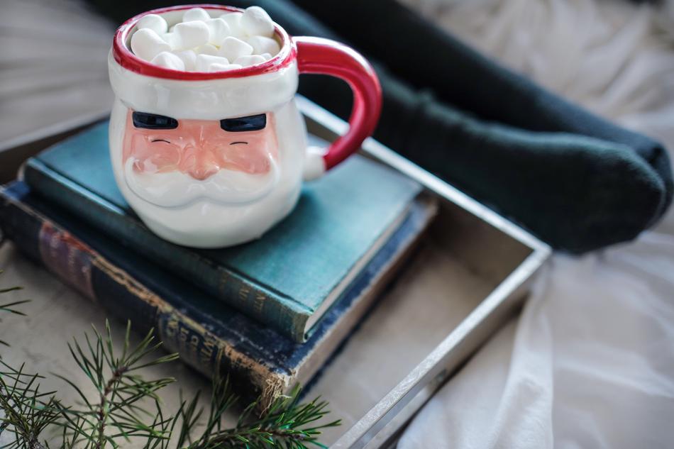 christmas cup stands on old books