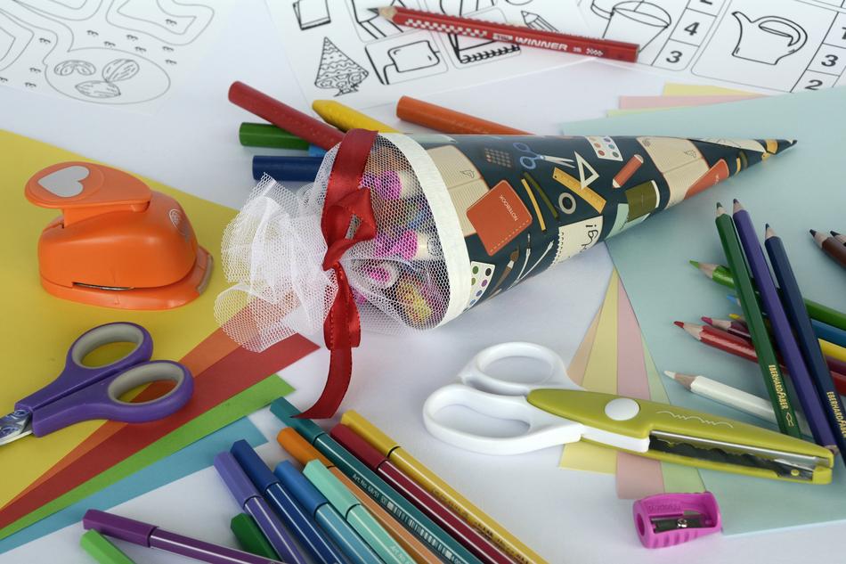 clutter of school supplies on the desktop