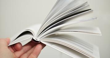 open book in hand