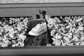 white sneaker on rails as a suicide problem