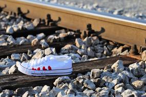 Stop Teenager Suicide sneaker on railway