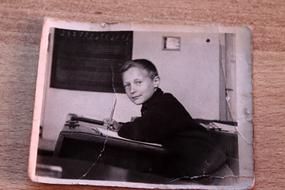 old photo of a boy at school