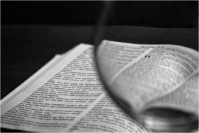 black and white, book page through glass