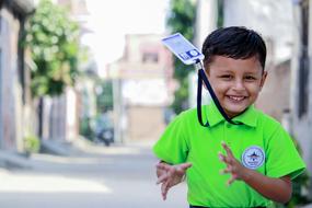 Smile School Boy with badge on neck