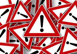 Black, white and red "Attention" road signs, in the pile, clipart