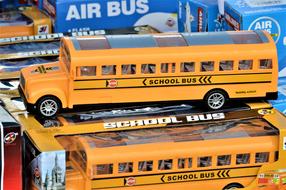 Two long orange and black American School Buses, Toy models