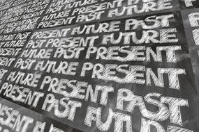 forward past present as a white lettering on chalkboard