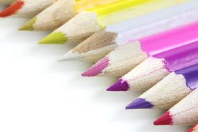 bright colored pencils on a white surface