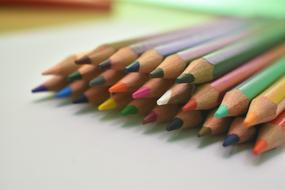 a stack of colored pencils