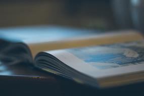 open vintage Book with drawing, soft focus