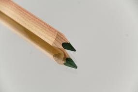 green pencil on glass table