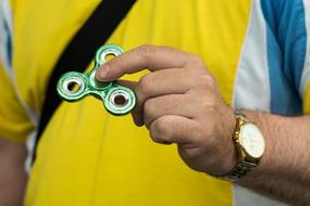 fidget spinner, Toy in male hand