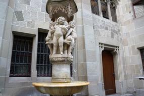 Beautiful fountain with the statues in FraumÃ¼nster, Zurich, Switzerland