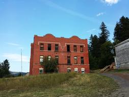 Old School, Abandoned Brick building at road, usa, idaho
