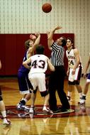 Basketball, young players and referee in Game