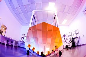Mirroring of people in masks on Space Telescope