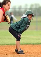 girls in uniforms in softball