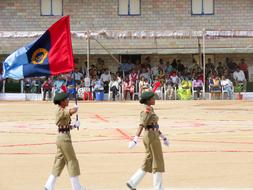 People, with the flag, in the NCC School, near the building