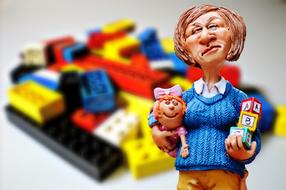 Babysitting figure against the background of Lego