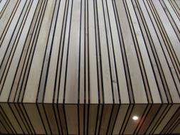 Close-up of the beautiful and colorful wood lines of the building