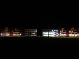 Landscape of the school with colorful lights, at night