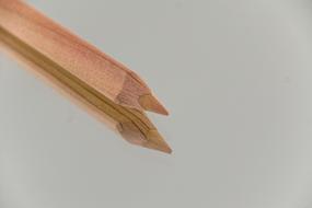 two beige Colored Pencils