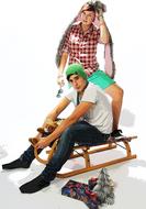 christmas photo of students on a sled in a photo studio
