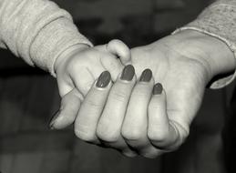 hands of woman and child close up