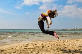 Girl Teenager Jumping beach
