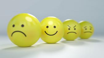 different emotions on yellow smileys