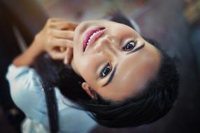 smiling girl with black eyes, close-up