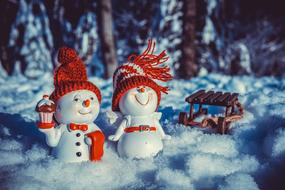 Snowman figures on snow