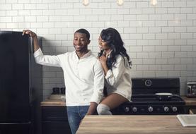 picture of Happy smiling couple in the kitchen